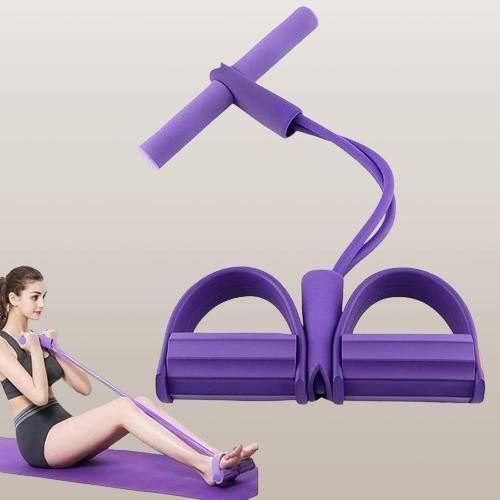 Purple resistance band exercise tool with a woman using it on a mat.